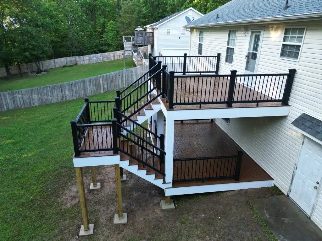 Multi-level deck with black railing built by Arellano Construction